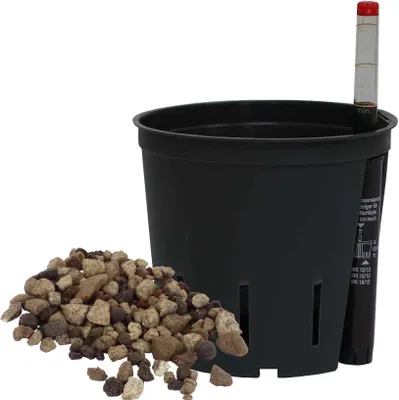 A black planter pot with a water level indicator and a pile of gravel.