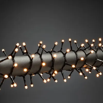 Produktbild von Konstsmide Micro LED Compactlights, gefrostet, 200 bernsteinfarbene Dioden, 30V, Innen, schwarzes Kabel - 3875-830
