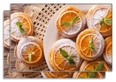 Produktbild von Wallario Frühstücksbrettchen 2er Set aus Glas, je 20 x 30 cm, mit rutschfesten Füßen, Motiv Frische Biskuits mit Orangenscheiben