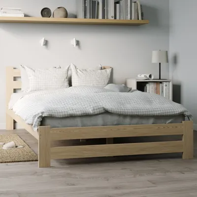 A bedroom scene with a wooden bed as the main focus.