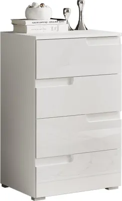 A white chest of drawers with decorative items on top.