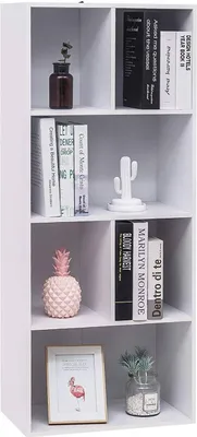 A white bookshelf with various decorative items and books on its shelves.