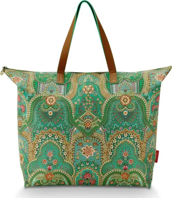 A large tote bag with a vibrant, intricate floral and paisley pattern in shades of green, gold, pink, and blue. The bag has two brown leather handles and a zipper closure.