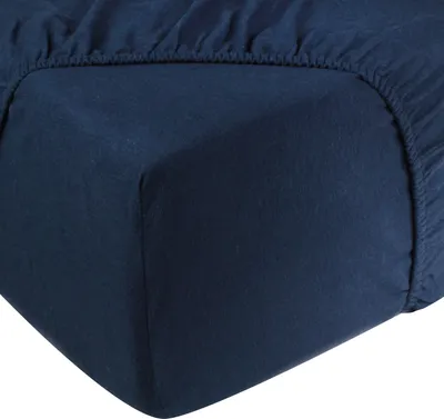 A close-up view of a navy blue fitted sheet corner.