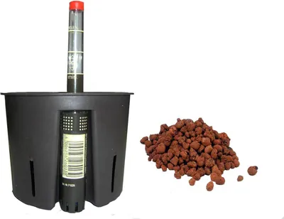 A self-watering pot and a pile of expanded clay aggregate.