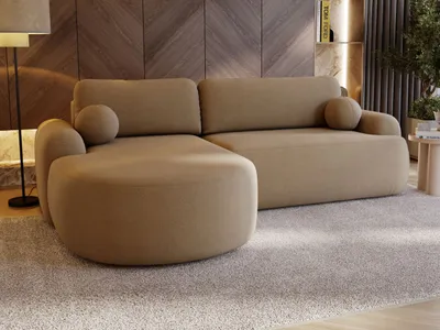 A modern living room with a beige sectional sofa and a wooden accent wall.