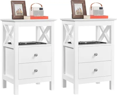 Two white wooden nightstands are shown side-by-side against a white background. Each nightstand has two drawers and an open shelf.