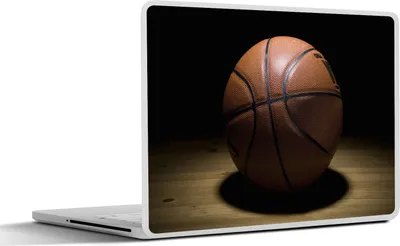 Produktbild von MuchoWow® Laptop Aufkleber Sticker Cover Ein Basketball im Scheinwerferlicht in einer Halle 30x22 cm - Laptop-Sticker