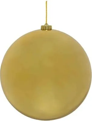 A single, large, gold Christmas ornament hangs from a gold string against a white background.