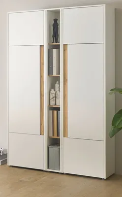 A white cabinet with wood accents and open shelving in the center.