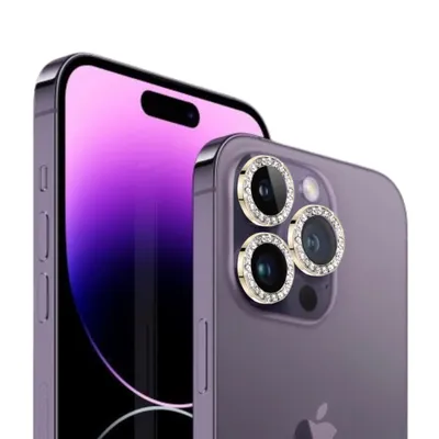 A close-up shot of the back of a purple iPhone 14 Pro Max with decorative gold and diamond-encrusted camera lens protectors.