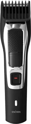A product shot of a black and silver hair clipper against a white background.