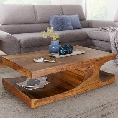 Immagine prodotto di Tavolino FineBuy in legno massello di sheesham 120 cm · Tavolino da salotto rettangolare con forma sinuosa e ripiano · Realizzato a mano e dal design unico