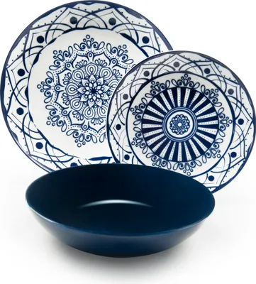 A set of blue and white patterned plates and a dark blue bowl are arranged on a white background.