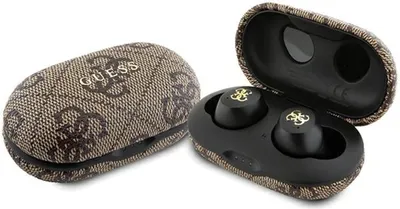 A pair of black wireless earbuds with gold logos, shown inside an open brown charging case with a Guess logo pattern.