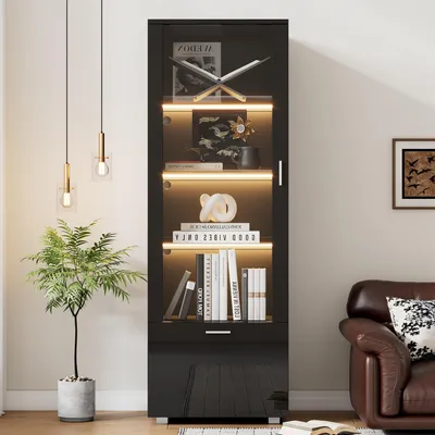 A modern living room with a display cabinet and a leather sofa.