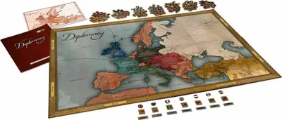 A board game map of Europe with game pieces and rulebooks.