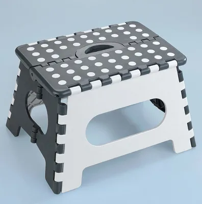 A folding step stool shown on a light blue background.