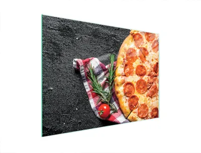 A pepperoni pizza is shown on a dark textured surface with a checkered cloth, rosemary, and a tomato.