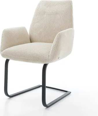 A beige corduroy armchair with black metal legs, photographed against a white background.