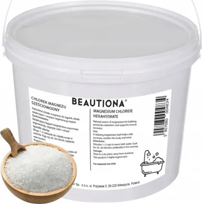 A white plastic tub of magnesium chloride hexahydrate bath salts, with a wooden scoop filled with the product in the foreground.