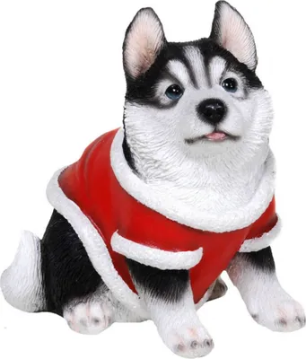 A figurine of a husky puppy wearing a red and white Santa coat, sitting on a white background.