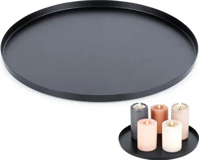 A black metal tray is shown from a top-down perspective, with a smaller black tray holding five candles in the bottom right corner.