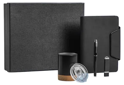 A set of office supplies including a notebook, pen, USB drive, and mug, presented in a gift box.