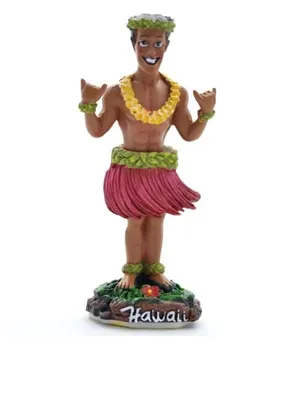 A figurine of a Hawaiian dancer on a decorative base.