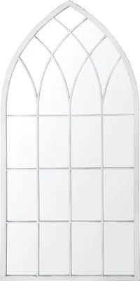 A tall, arched mirror with a gothic window design.