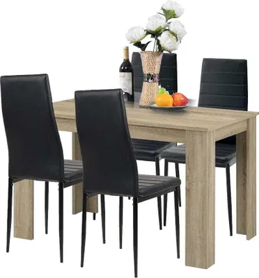 A dining table with four chairs.
