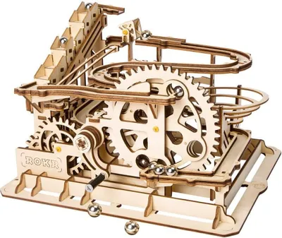 A wooden marble run toy with metal balls.