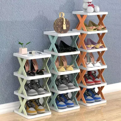Multiple shoe racks filled with shoes are displayed against a light blue wall.