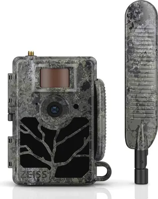 A camouflage-patterned trail camera and its antenna are displayed against a white background.