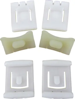 A product shot of several plastic car parts against a white background.