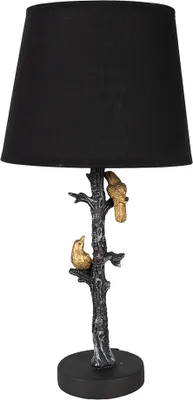 A table lamp with a black lampshade and a decorative base shaped like a tree with two birds.