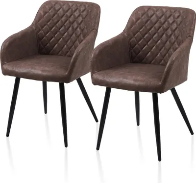 Two brown upholstered dining chairs with black legs.