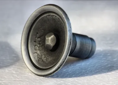 A close-up, studio shot of a metal door handle or knob.