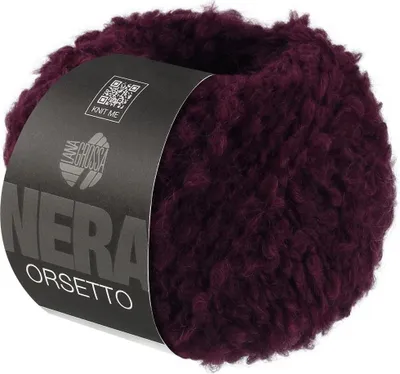 A ball of burgundy yarn with a label.