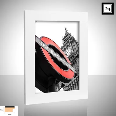 A framed picture of the London Underground sign with Big Ben in the background.