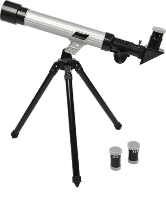 A silver and black telescope on a black tripod, with two small accessory tubes in the foreground.