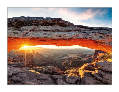 Produktbild von Wallario Herdabdeckplatte aus Glas, Größe 70 x 52 cm 2-teilig, Motiv Sonnenstrahl am Horizont  Leuchtende Felsspalte