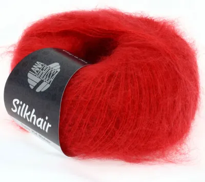 A ball of red yarn with a black label.