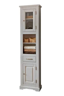 A tall, narrow white bathroom cabinet with a glass-doored upper section and a solid lower section.