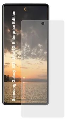 A screen protector is placed over a phone displaying a sunset image.