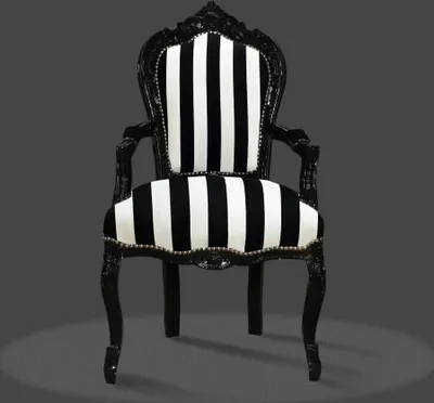 A black and white striped armchair against a plain gray background.