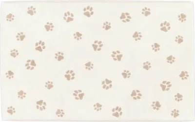 A flat lay of a bath mat with a paw print pattern.