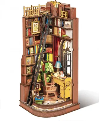 A miniature, detailed diorama of a study room inside a bookshelf.