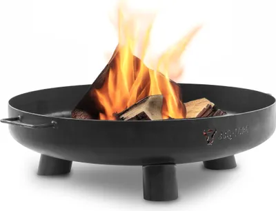 A black metal fire pit with wood burning inside, set against a white background.