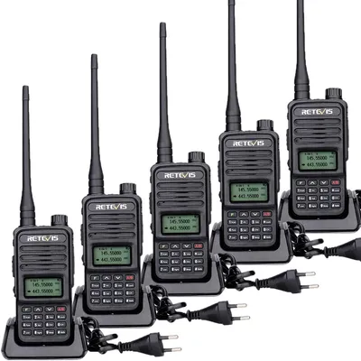 A set of five black Retevis walkie-talkies are arranged in a diagonal line on a white background, each in its charging cradle with a power cord attached.